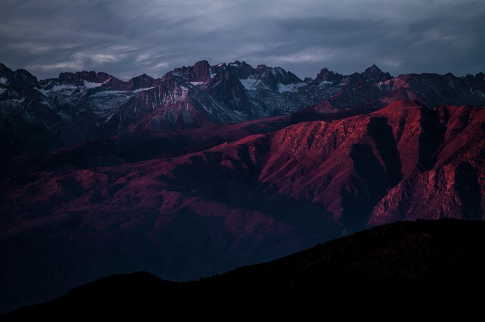 Mountains at sunset with snow-capped peaks