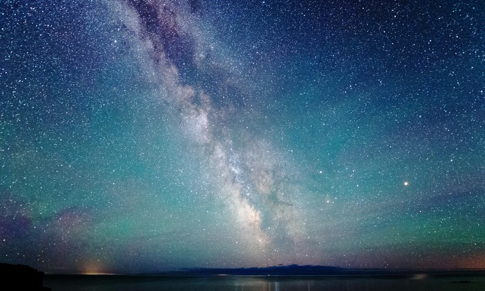 Milky Way galaxy over a calm body of water