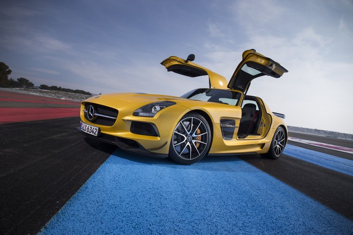 Yellow Mercedes-Benz SLS AMG Gullwing on a Racetrack