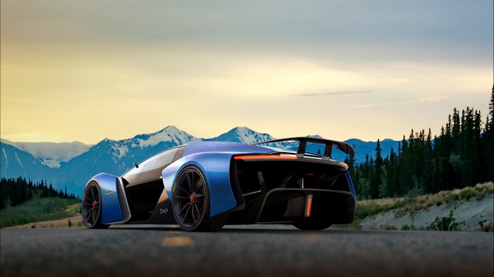 Blue concept car on a mountain road