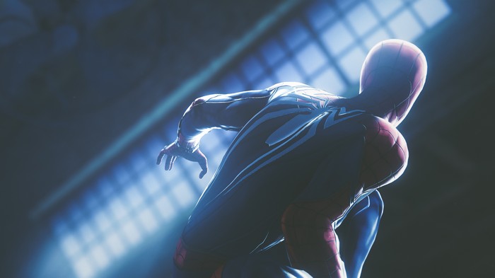 Spider-Man in a dark, lit arena