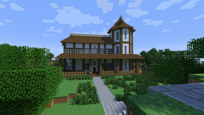 Minecraft house with wooden exterior and glass windows