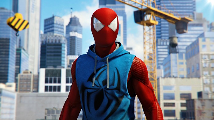 Scarlet Spider in a blue hoodie with a spider logo
