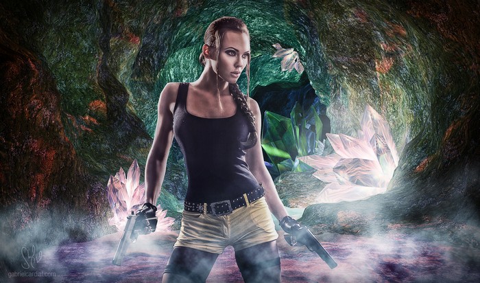Lara Croft in a crystal cave with guns