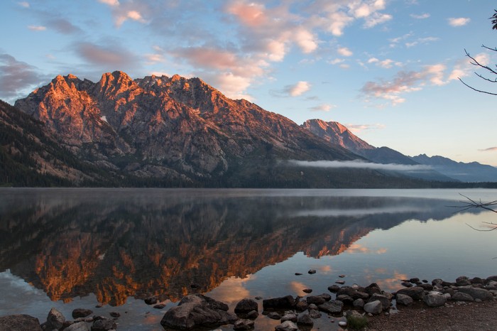 Mountains reflected in a lake at sunrise