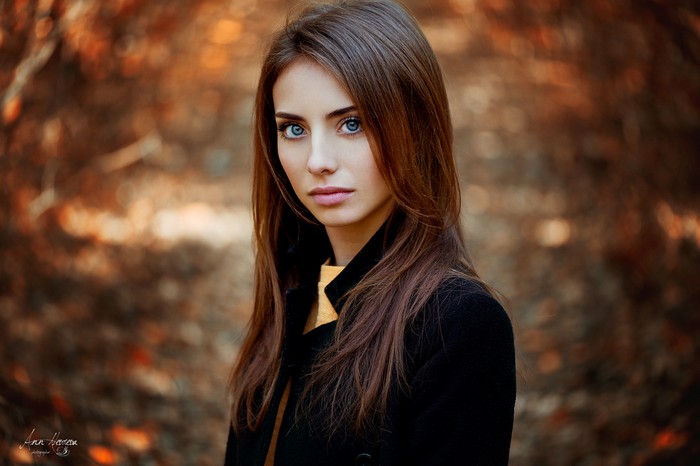 Portrait of a Woman with Blue Eyes in Autumn