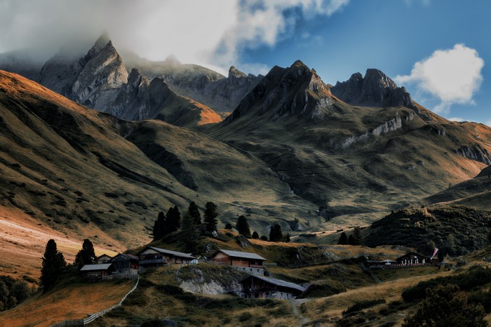 Mountain Village Nestled in Scenic Alpine Landscape 4K