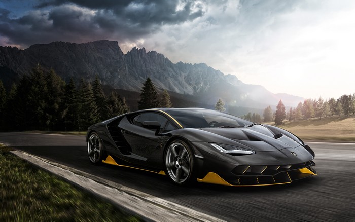 Black Lamborghini Aventador with Yellow Accents on Mountain Road