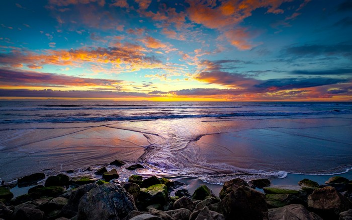 Sunset over the ocean with dramatic clouds