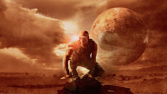 Riddick on a desolate planet with two moons