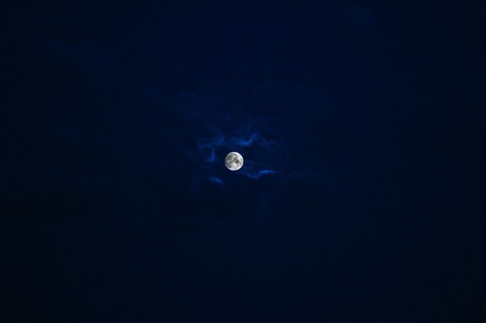 Full moon in a dark night sky