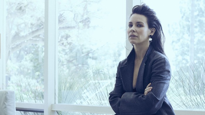 Evangeline Lilly in a dark suit