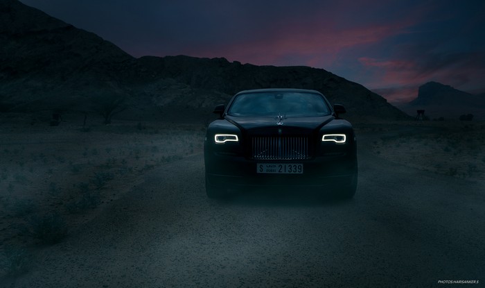 Rolls Royce Wraith in a desert at dusk