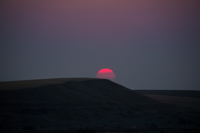 Sunset over rolling hills