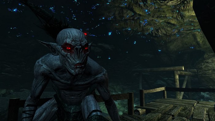 Creature with red eyes in a dark cave from Skyrim
