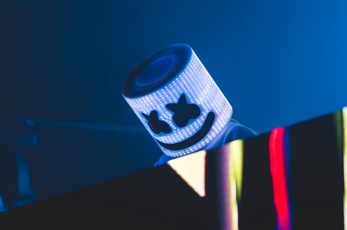 Marshmello performs on stage with LED mask