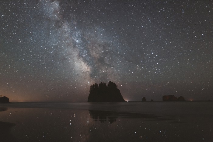 Milky Way over a rocky coast at night