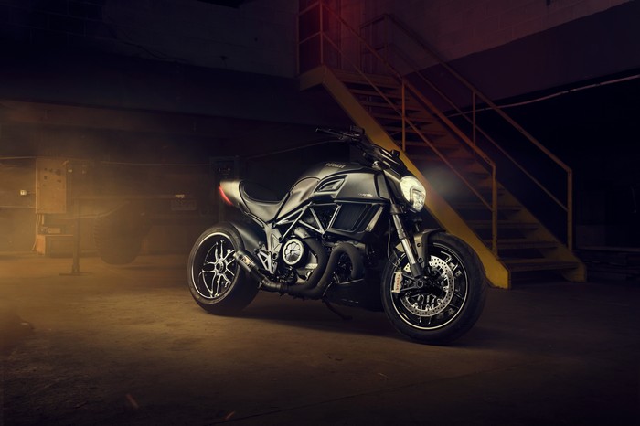 Ducati Diavel motorcycle in a dimly lit industrial setting
