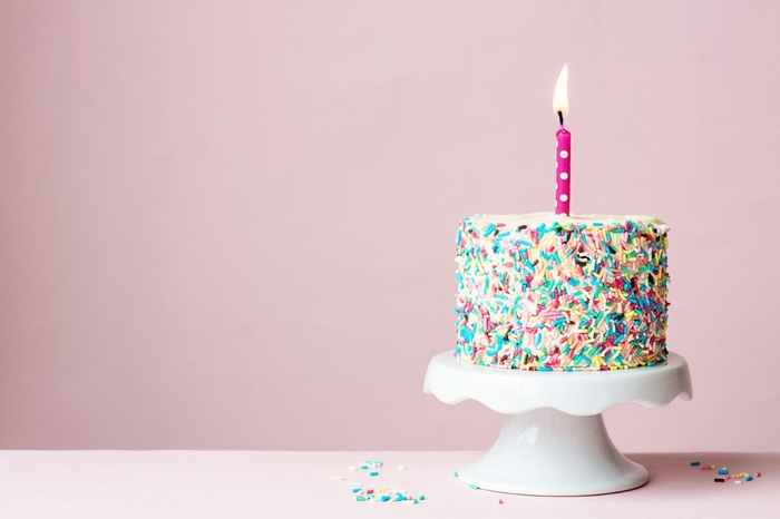 Birthday cake with a lit candle