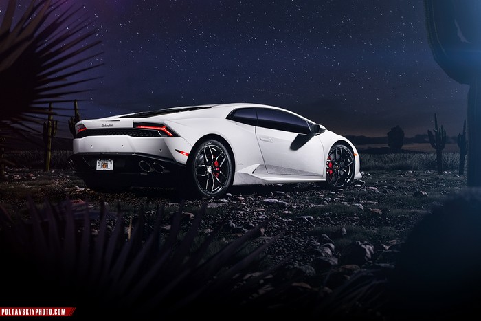 White Lamborghini Huracan parked at night under stars