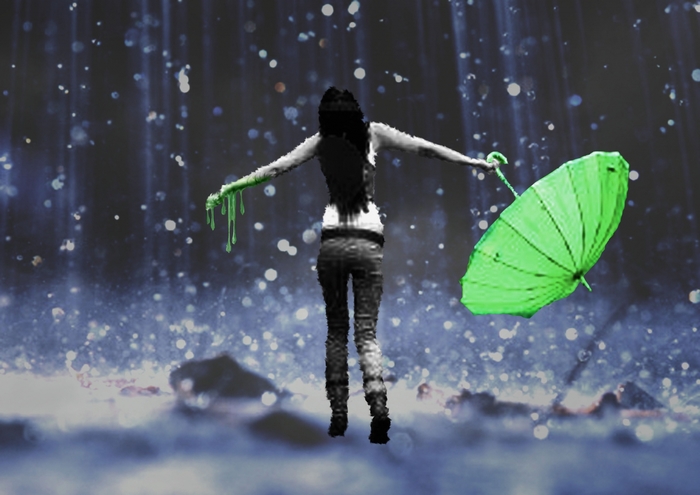 Woman with green umbrella in the rain