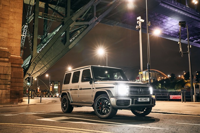 Mercedes G-Class SUV under a bridge at night