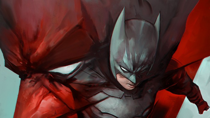 Batman in a dark suit with a red cape