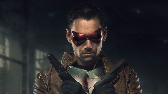 Red Hood holding guns