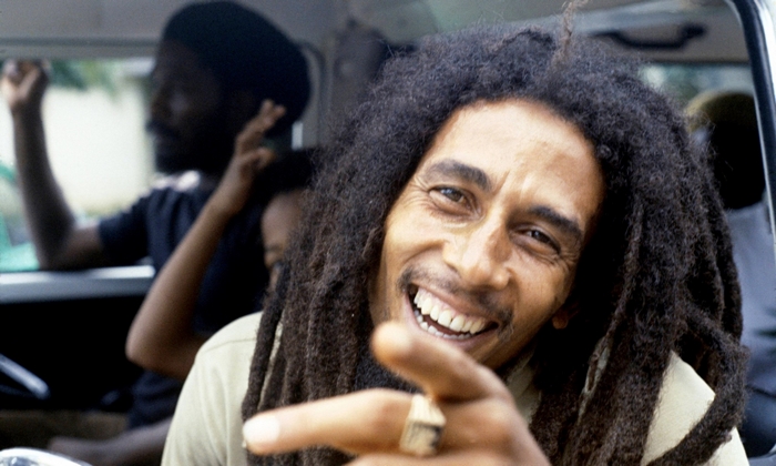 Bob Marley Smiling with Dreadlocks Pointing