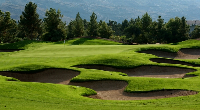 Golf course with sand traps and green