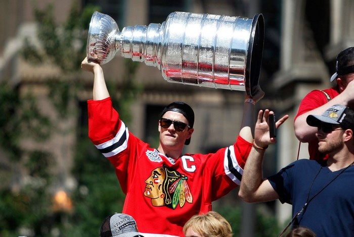 Chicago Blackhawks player holding the Stanley Cup