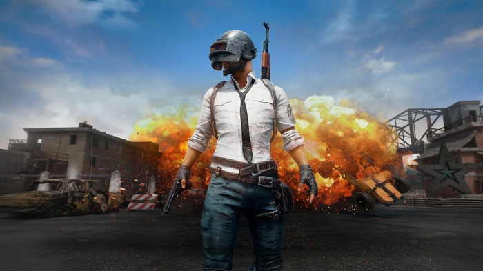PlayerUnknown's Battlegrounds character with explosion in background