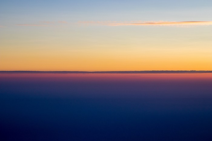 Minimalist sunset over clouds