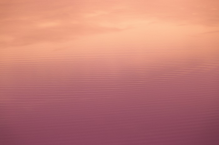 Minimalist 4K water surface with sky reflection