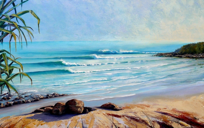 Beach with waves and palm leaves
