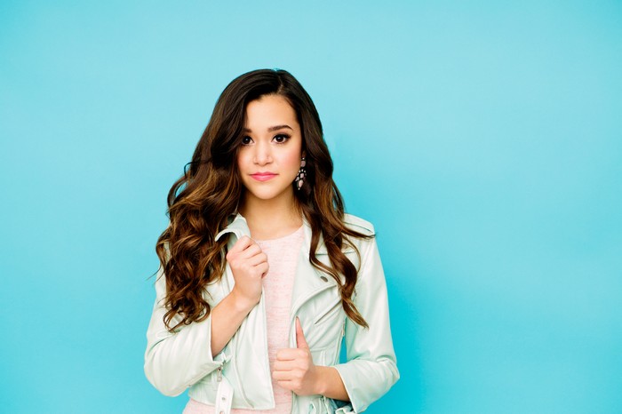 Megan Nicole in a light blue jacket
