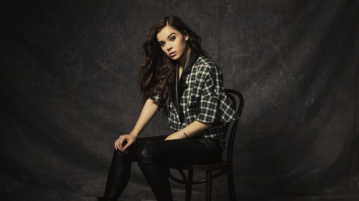 Hailee Steinfeld sitting on a chair