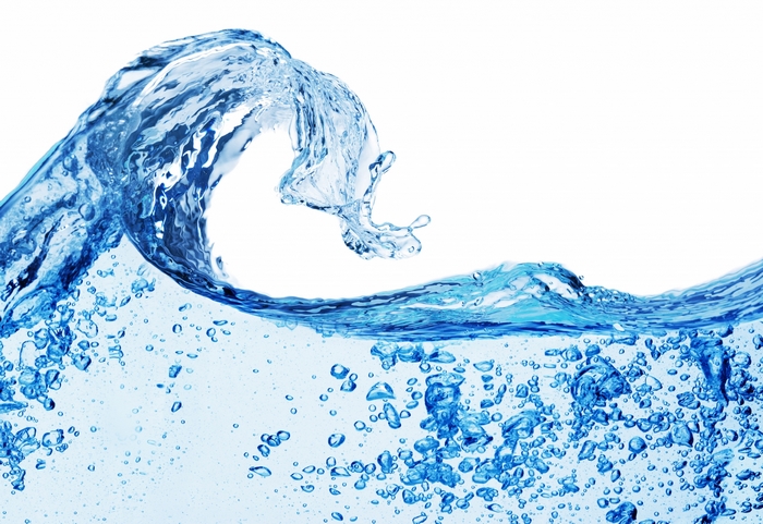 Wave of blue water with bubbles