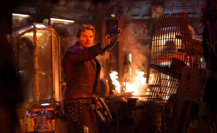 Star Lord holding guns in a fiery room