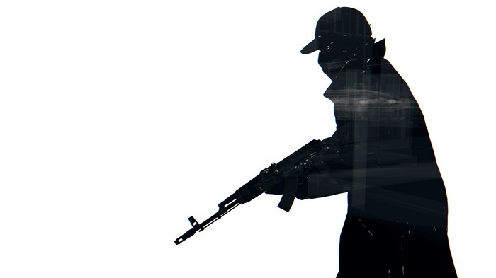 Silhouette of a person holding an assault rifle