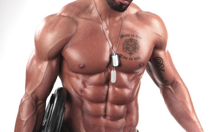Muscular man with tattoos and dog tags