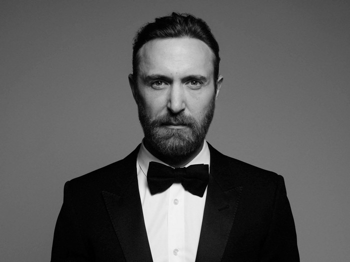 David Guetta in a black tuxedo and bow tie
