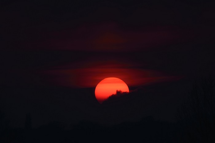 Sunset behind dark clouds