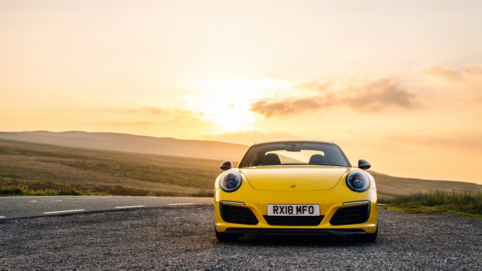 Yellow Porsche 911 on a Road at Sunset