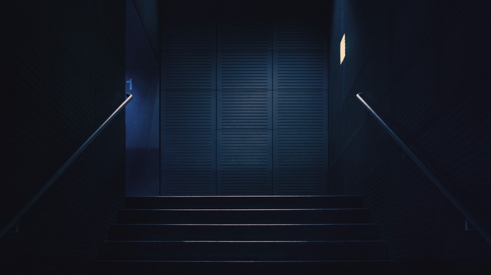 Dark minimalist stairs with blue light
