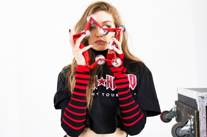 Gigi Hadid holding a star-shaped tambourine