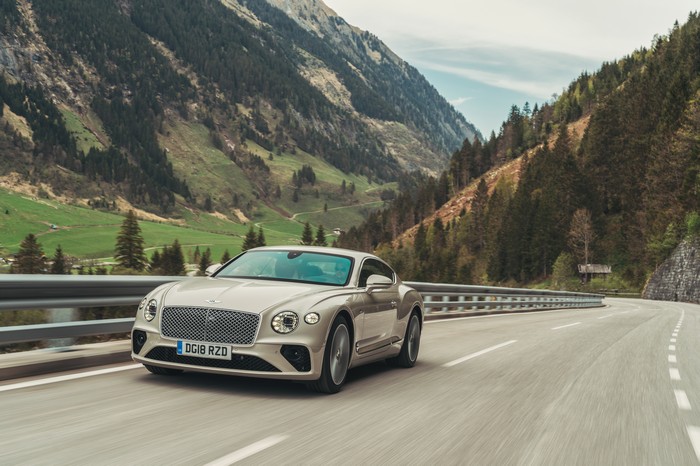 Bentley Continental GT driving on a mountain road