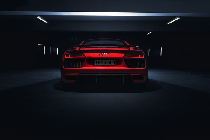 Red Audi R8 in a dark parking garage