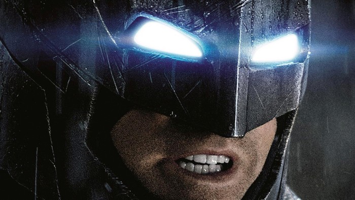 Batman with glowing eyes and bared teeth