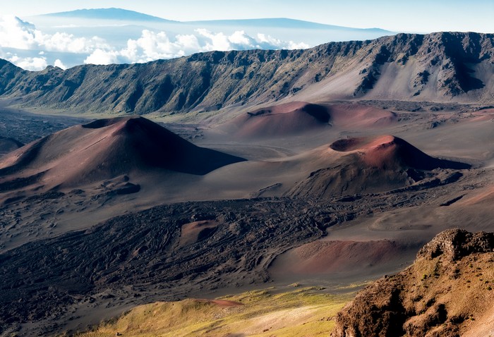 Volcanic craters and mountains under a clear sky
